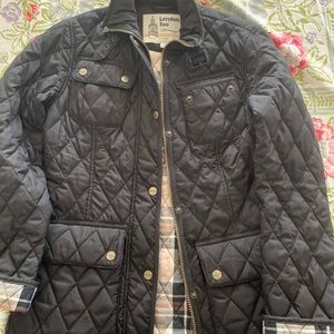 London fog black jacket with plaid lining, zips and snap closure.